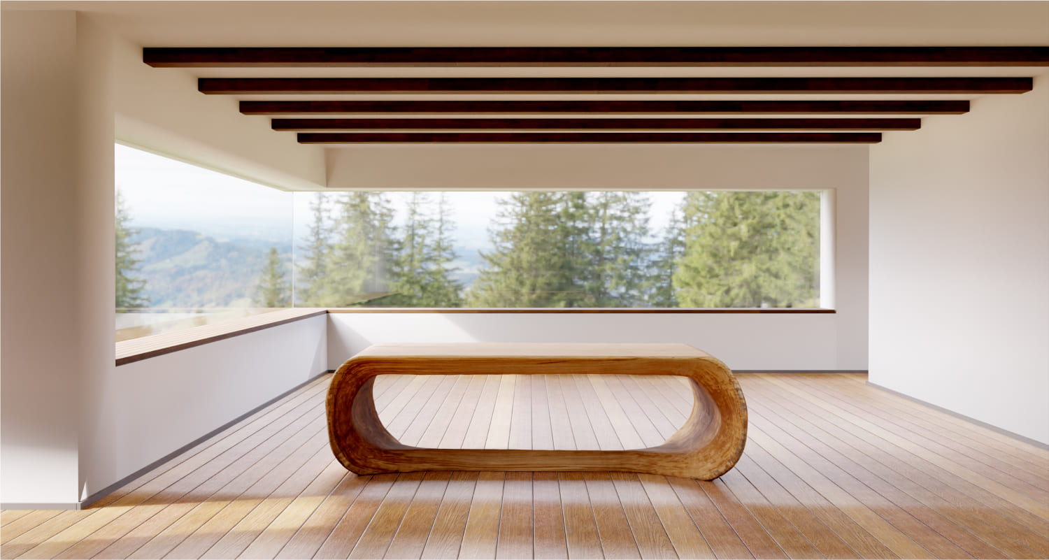 Sculpted solid wood OZE table in minimalist room with panoramic forest view