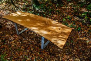 Custom handmade oak table, crafted from a single piece, redefining luxury in Saudi Arabia; price range 18,000–650,000 AED, bespoke for exclusive interiors